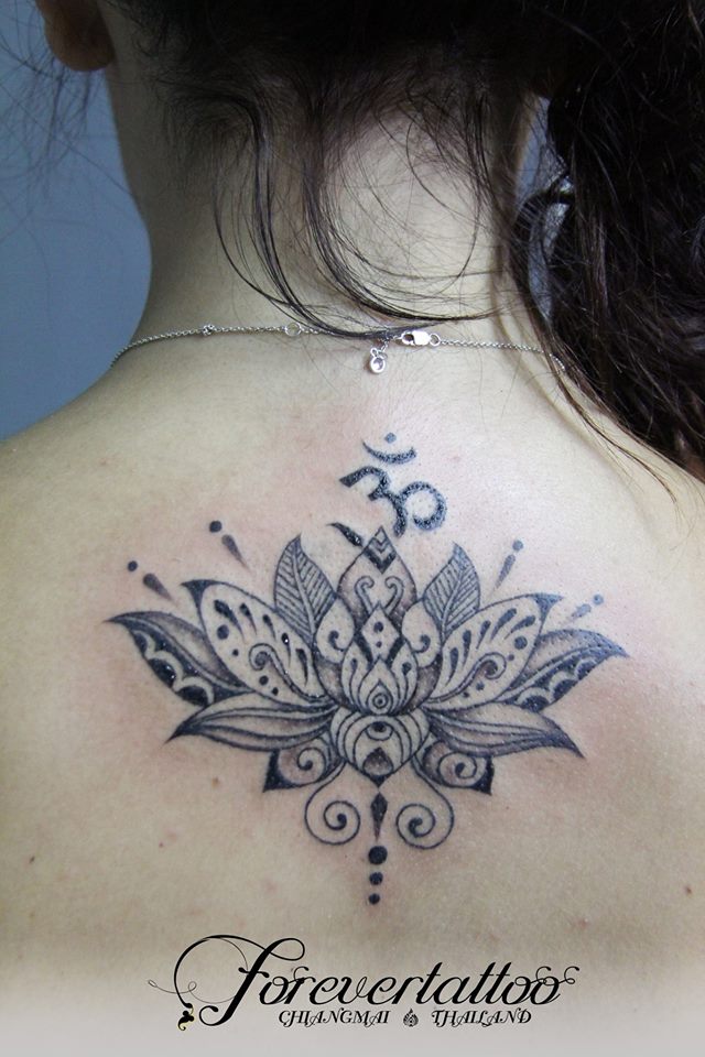 lotus flower tattoo with om