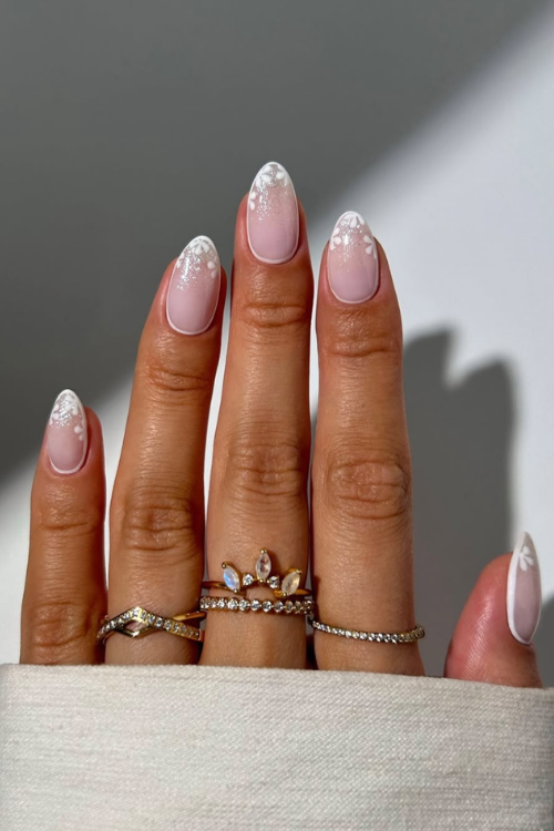 30 Creative Nail Art Ideas: Unlock Stunning DIY Designs at Home! 13 white florals with hint of sparkle