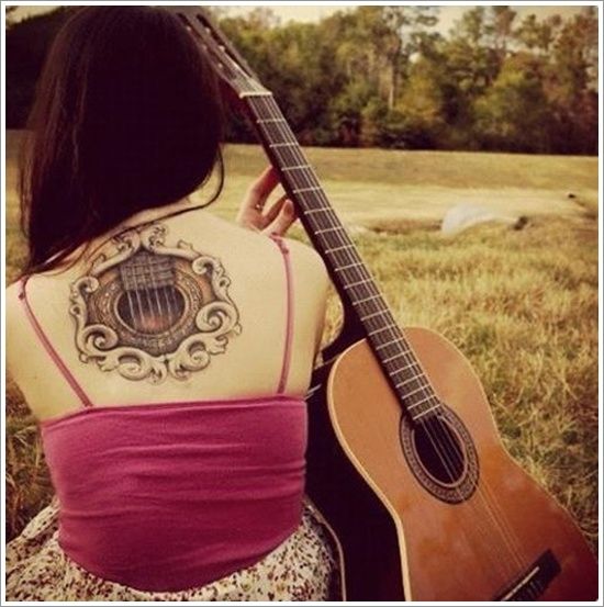 Appealing Acoustic Guitar Tattoo on Back for Girls