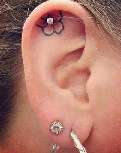 Incredibly Feminine and Pretty Inner Ear Floral Tattoo to Decorate With a Stone Studded Earring