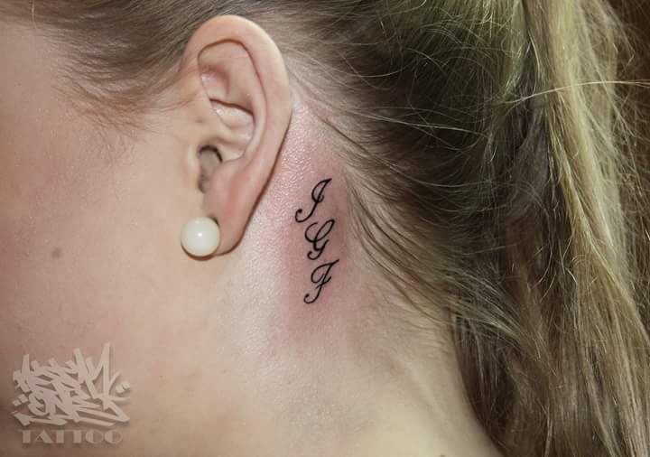 Mysterious Cursive Initials Tattooed Behind the Ear Look Discreetly