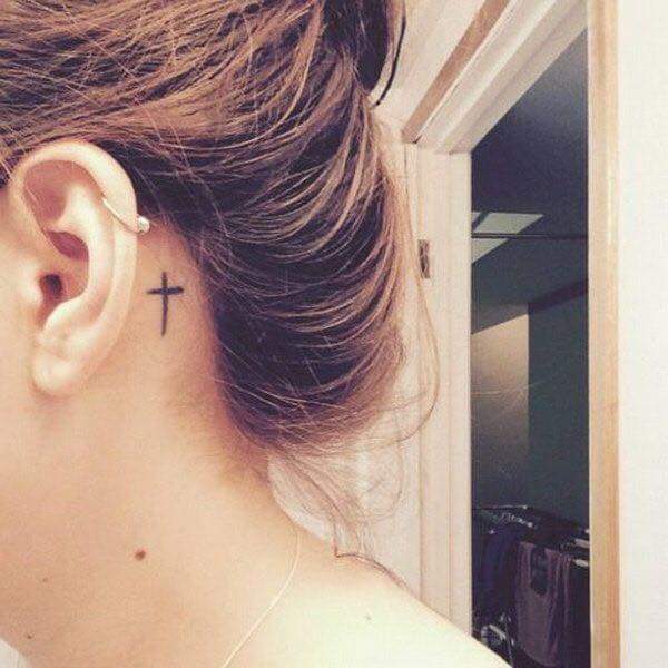 Symbolic Tiny Cross Tattoo Behind the Ear