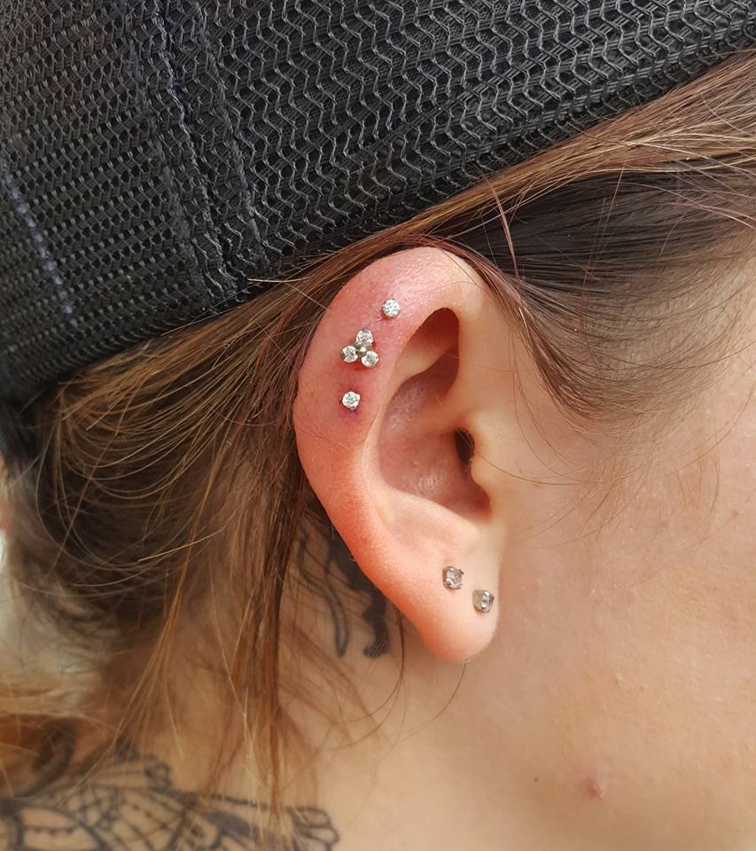 Triple Piercing in the Upper Ridge of Chrissy's ear