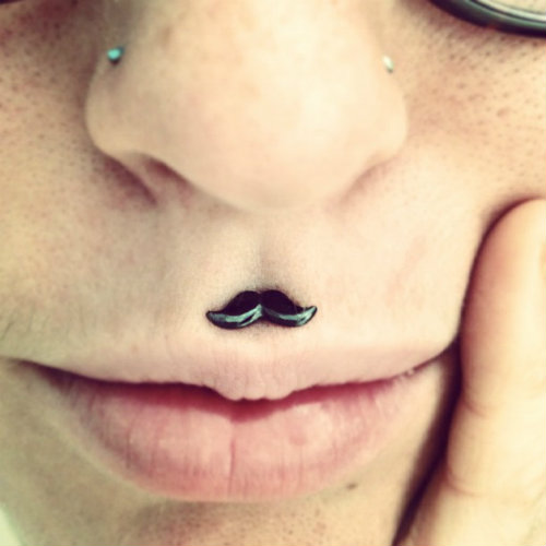 Women Labret Piercing with a Quirky Moustache Shaped Jewelry