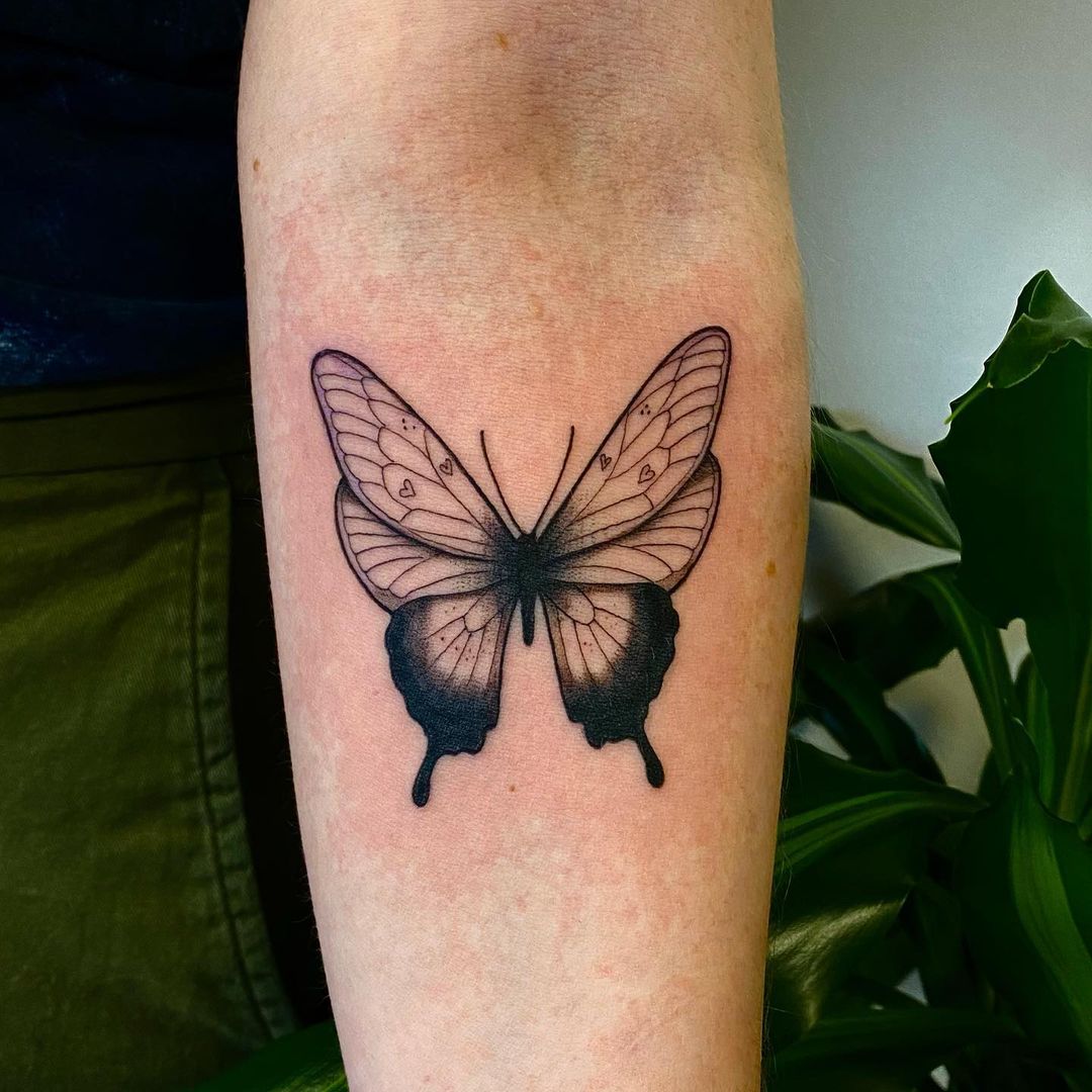 Simple Geometric Butterfly Tattoo on the forearm