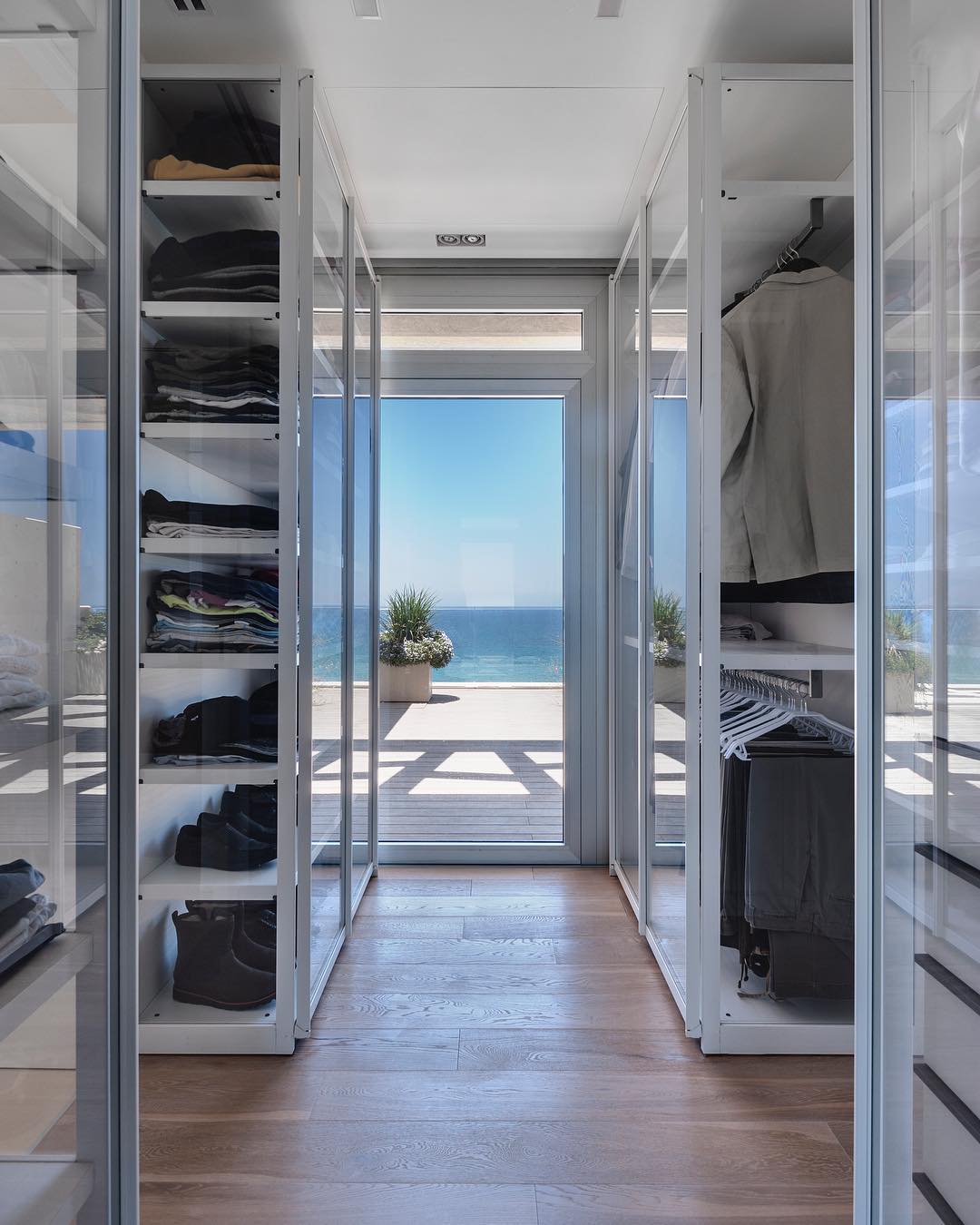 A bedroom with a walk-in closet