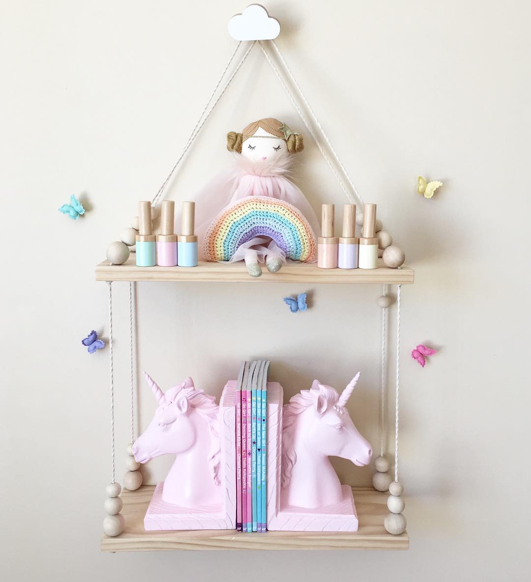 Hanging shelf with pastel-colored objects