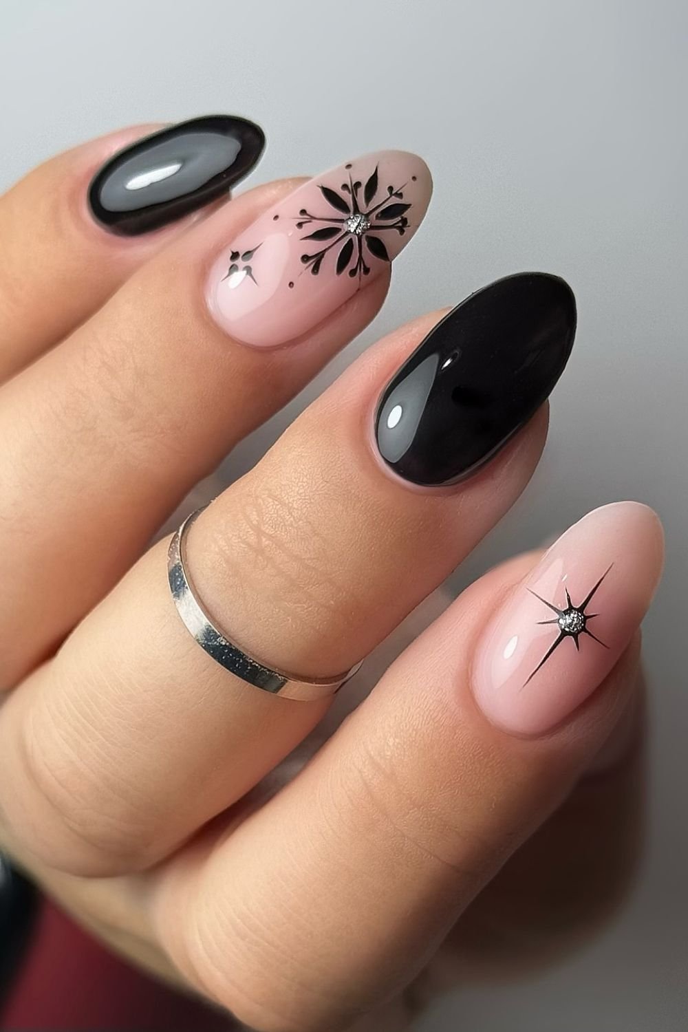 30 Black Nail Art Designs 2025: Unleash Your Style with Trendy Looks! 27 Floral Snowflake Elegance