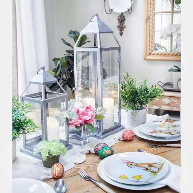 Easter Tablescape With Colorful Eggs and Pink Flowers