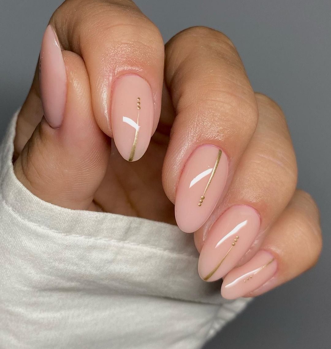 Elegant Almond Nails with Gold Accents