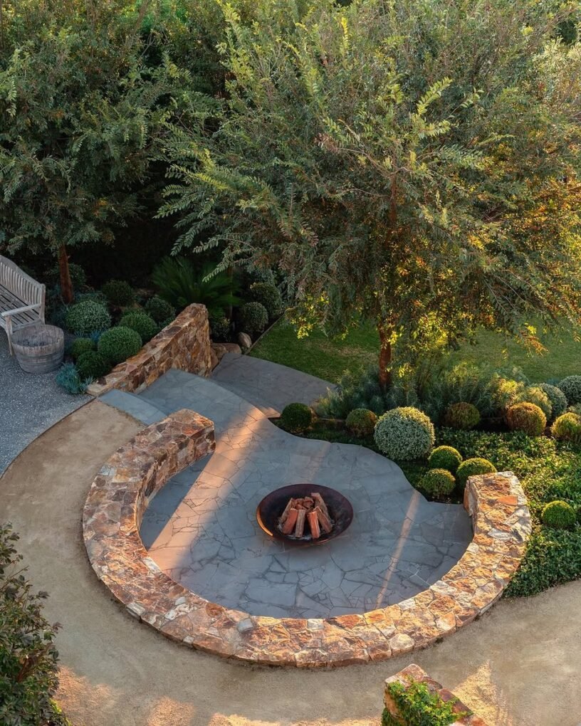 20 Modern Outdoor Fire Pit Ideas: Sleek Designs for Any Home 18 Fire Pit with Surrounding Garden Beds