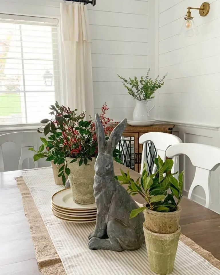 Gray Rabbit Centerpiece on a Beige Table Runner