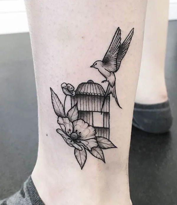 Black and grey bird cage tattoo