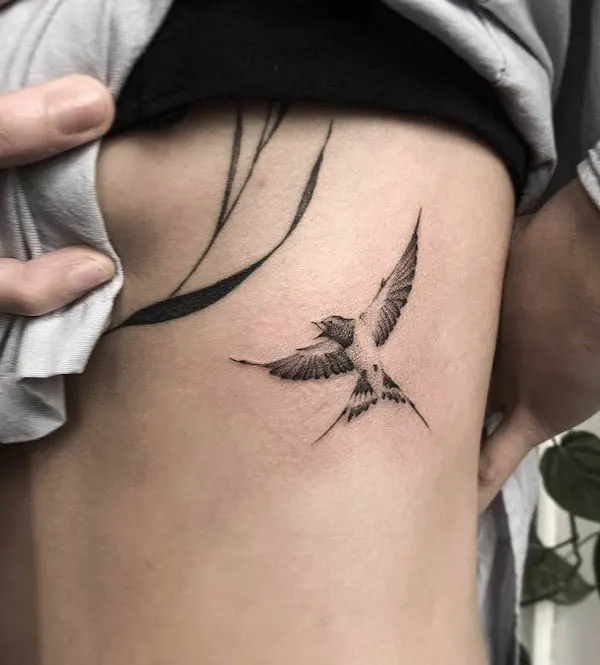 Black and white sparrow rib tattoo