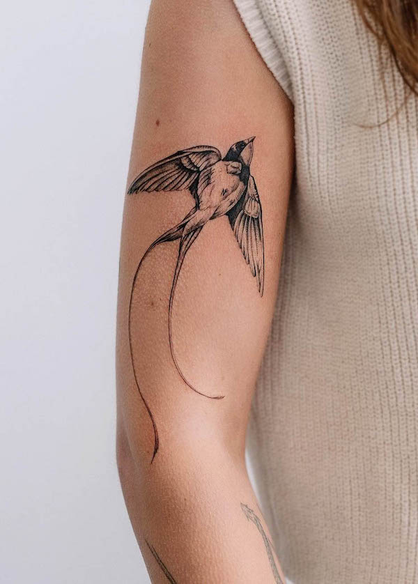 Elegant swallow arm tattoo