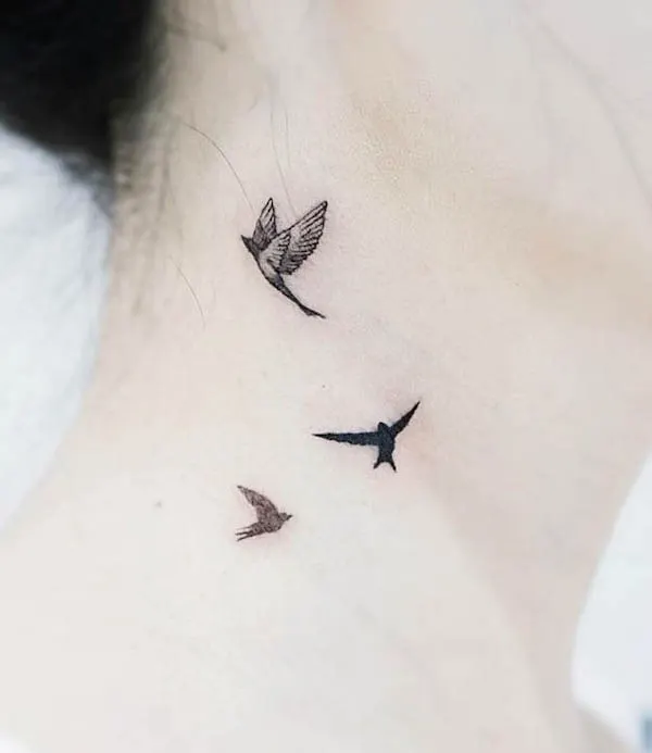 Flying birds neck tattoo