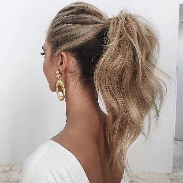 Messy High Ponytail With Tousled Strands