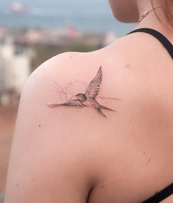 Small swallow shoulder tattoo