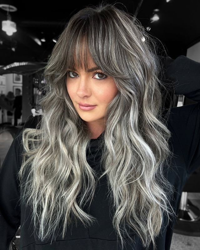 Voluminous Gray Waves with Feathered Bangs