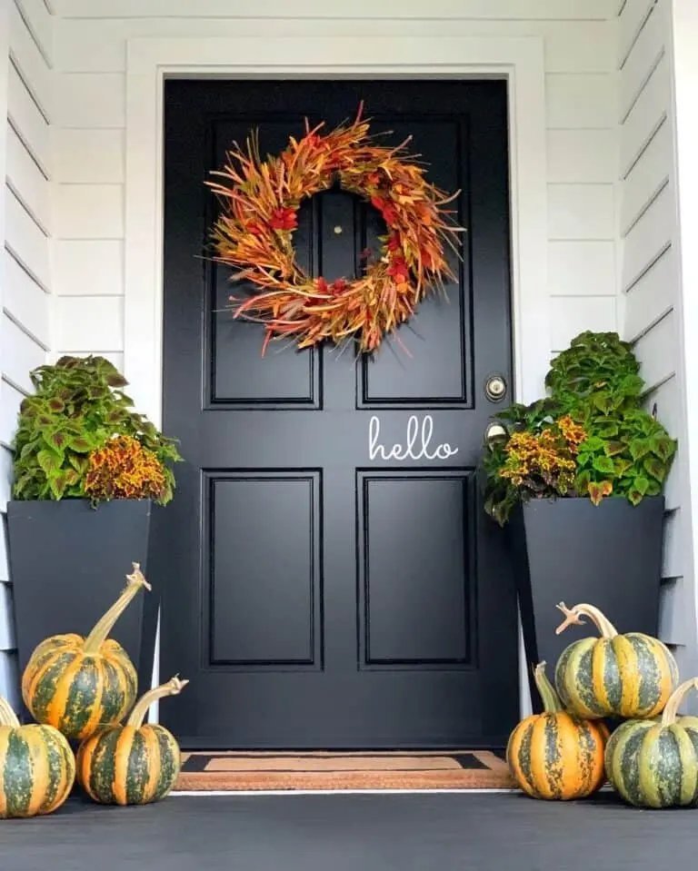 From Simple to Showstopper: 25 Easy Fall Door Decor Ideas 17 Black Door with Pumpkins