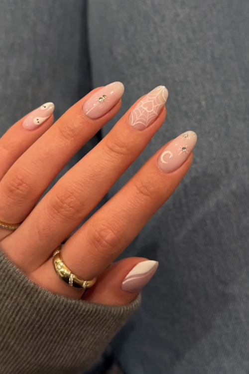30 Halloween Nail Art Ideas 2025 for a Hauntingly Good Look 18 Crystal Webs & Whispers