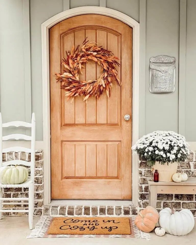 From Simple to Showstopper: 25 Easy Fall Door Decor Ideas 11 Natural Wood Door with Wreath