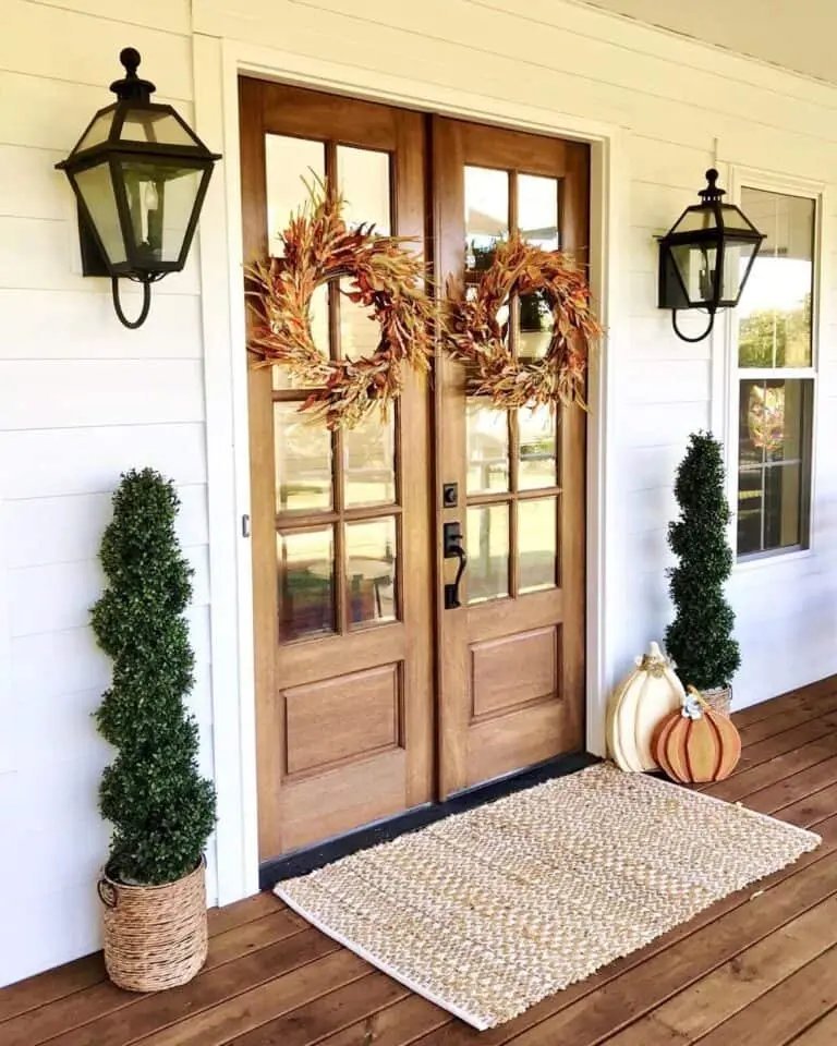 From Simple to Showstopper: 25 Easy Fall Door Decor Ideas 12 White Home with Wood Doors