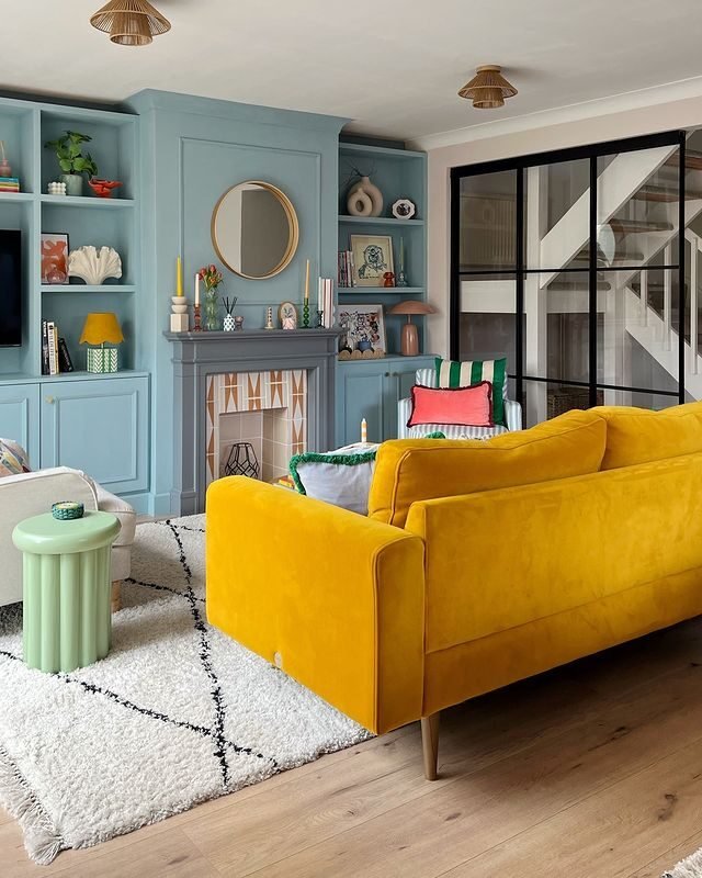 15+ Blue and White Living Room Ideas for a Timeless Look 9 Blue Smoke Wall with Orange Gold Accents