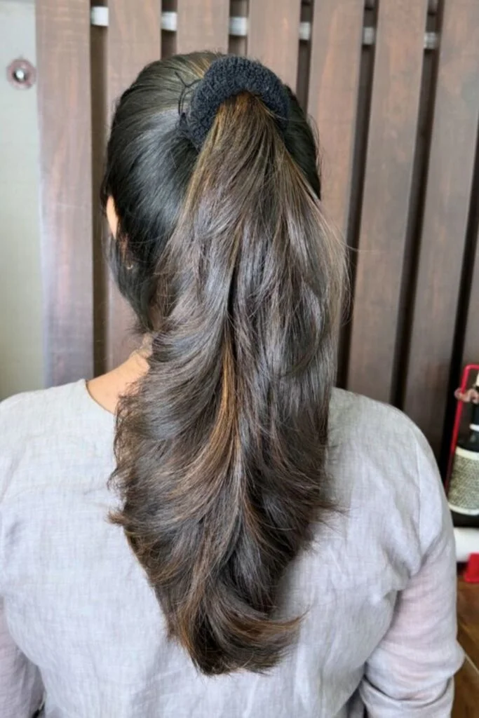 Sleek and Stylish: 20 Low Ponytail Hairstyles You’ll Love 21 Cascading Curls Low Ponytail