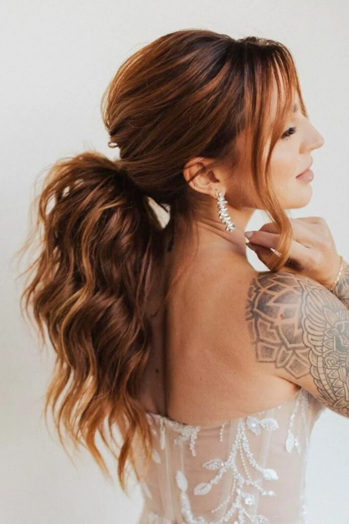 Sleek and Stylish: 20 Low Ponytail Hairstyles You’ll Love 20 Sun-Kissed Wavy Low Ponytail