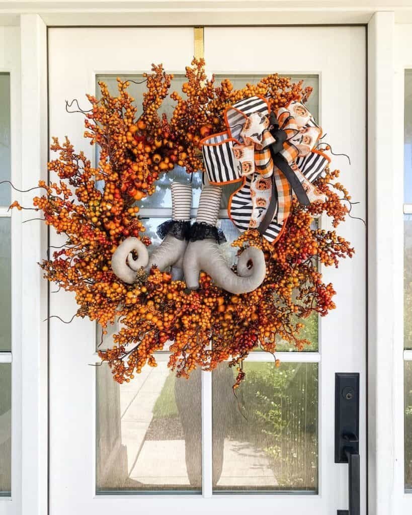 25 Chic & Cozy Fall Wreath Ideas to Celebrate the Season 15 Orange Berry Wreath Decor