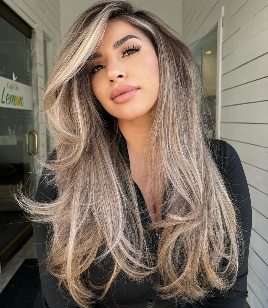 Layered Ash Blonde with a Side Part