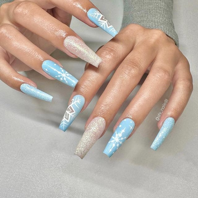 Blue Nails With White Snowflake Stamping