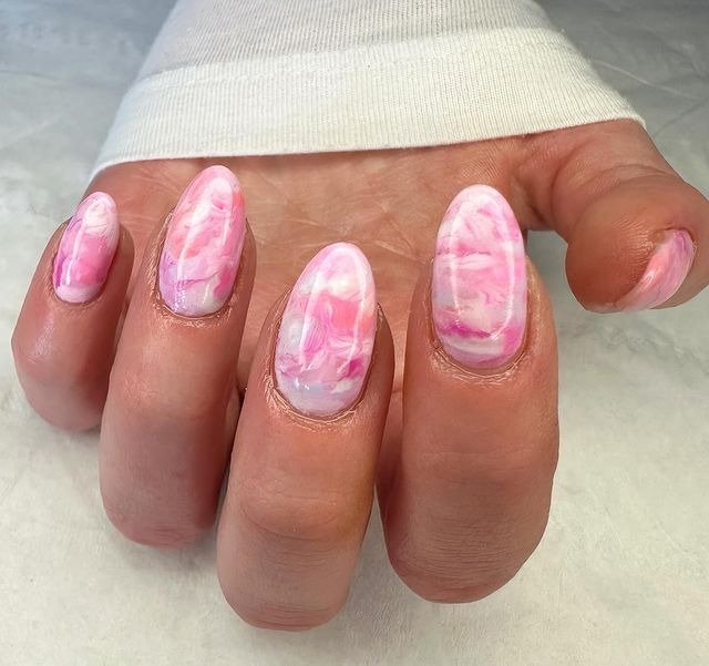 Pink Nails with White Marble Accent Nails