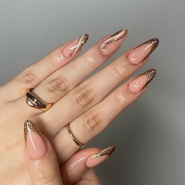 Nude Nails with Gold Glitter Tips