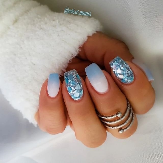 25 Funky Winter Manicure Designs You’ll Want to Try 1 Icy Blue Frostbite Nails